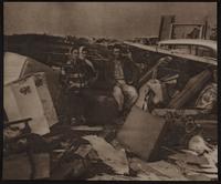 R. B. Cook family among the rubble of their home south of KCMO.