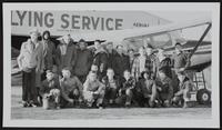 LJW - carriers win airplane rides (L to R) Standing Arlen Richardson; Delbert Richardson, pilot; Jesse Newman; Dave Rood; Charles Saunders; Whitney Westgate; J. D. Walker; Doyle Williams; Ron Newman; Dick Osborn; Pete Argersinger; Lewis Higgins; John Hines. (Front Row) Kenneth Lanon; Steve Glass; Bill Smith; Mike Pendleton; Ken Servos; Frank Hines; Elmer Goolsby; Ronnie Norris; Larry Barret.