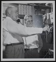 Dial phones - Lecompton - Mayor George F. Bahnmaier uses phone and Owen Smith, manager of Lawrence Office looks on.