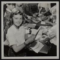 Christmas Seals stuffing envelopes - Vicky Mingos.