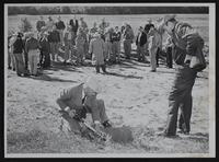Soil conservation - Willis Colman digs up ground to show Lawrence ministers results - County Conservationist Melvin Wertzberger looks on.