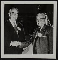 C. G. Hesse (Right) accepts award from W. L. Davis.
