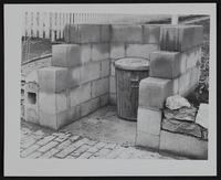 Lawrence Eyesores - Alley improvement - A improved method of protecting garbage from roaming dogs. B hiding trashcan and preventing trash from being scattered.