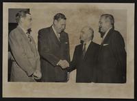 Left - Bill Bodin, Right - Dolph Simons, Sr. L center, Karl Koeper - KC Ch. of Comm. Right Center. Mayor Chris Kraft.