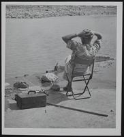 KS River - unidentified fisherman in easy chair.