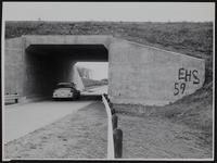 Lawrence West 6th street underpass receives first painted sign &quot;EHS 59&quot;.