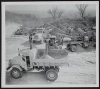 Kansas Turnpike - equipment of B. L. Anderson Co. for hauling gravel for paving.