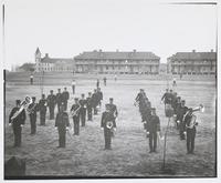 Group Portrait of 6th Cavalry Band in Field in Front of Large Building at Fort Riley