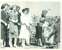 Kansas Relays queen accepting a bouquet