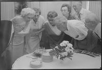 The group celebrates a birthday