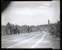Kansas Relays athletes finishing a race