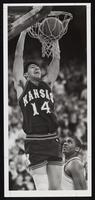 University of Kansas Basketball Player Kevin Pritchard Hanging from Basketball Hoop After Scoring