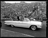 Homecoming Queen candidates riding in car