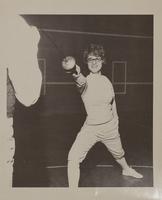 Fencing athlete in a lunge position