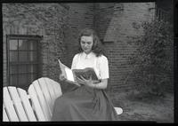 Woman reading a New Yorker magazine