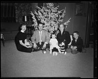 Family in front of the Christmas Tree