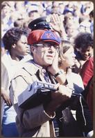 Football Fan Holding a Radio at the University of Kansas v. University of Oklahoma Game