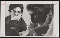 Two men in discussion at Spencer Research Library