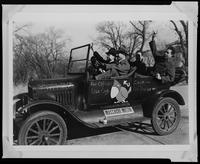 KU football fans in a decorated car